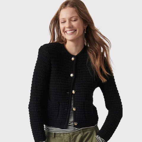 Introducing the Gaspard Cardigan by Ba&sh. Crafted to combine the look of a couture style jacket with the softness of knit, the Ba&sh Gaspard Cardigan is designed to add a touch of luxury and elegance to any look. It features a round neckline, 7/8 length sleeves, gold buttons, and subtle shoulder pads for structure. Look stylish yet sophisticated with this unique cardigan. 