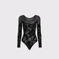 Experience the romance of Wolford's Bodysuit 78312/F23! The high-contrast matte floral lace combines with a slim fit style and seamless design to create an irresistibly beautiful look that's as elegant as it is comfortable. The snap closure and cotton gusset make it easy to wear and the knitted hemlines of the long sleeves add a touch of sophistication. Show off your beauty and grace with this timeless bodysuit!