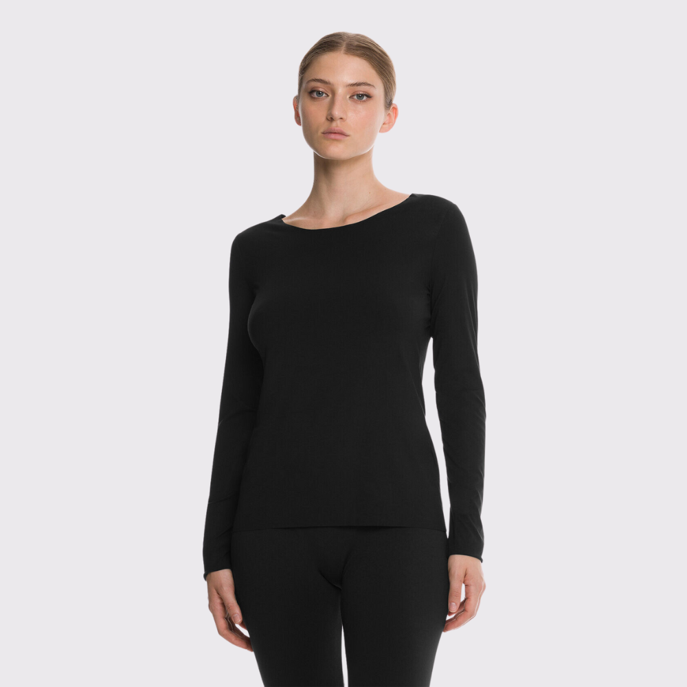 The Wolford Top 52765/Blk/F23 is the epitome of stylish sustainability. Crafted with biodegradable components, this slim pullover offers luxurious comfort and a modern matte look, making it a timeless staple in your wardrobe. Highlighting innovative design and Cradle to Cradle Certified™ at the gold level, this top is a symbol of new beginnings and a testament to quality.