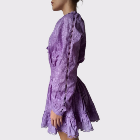 This Hemant & Nandita dress is a must have for the summer season! The dark lavender hue is perfect for a night out, while the smocked waist and ruffle details add stylish touches. With a tassel hem, this dress will make you look and feel fabulous!