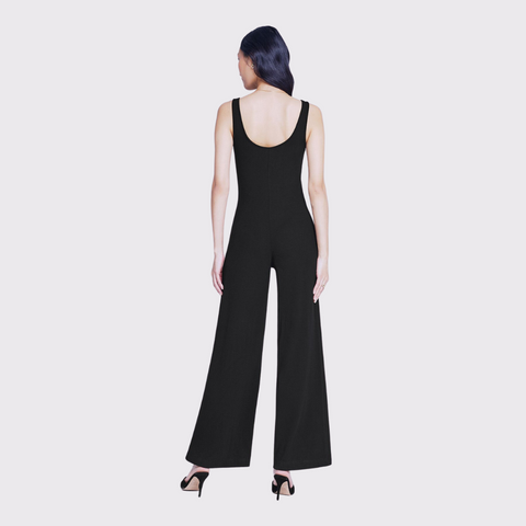 Discover the perfect balance of timeless style and luxury with the Evette Sleeveless Jumpsuit by L'Agence! The sleek sleeveless design, tapered waist, and wide flared legs, this jumpsuit will make you feel both glamorous and sophisticated. Perfect for a night out or a special occasion, you'll be having a fashion moment to remember!