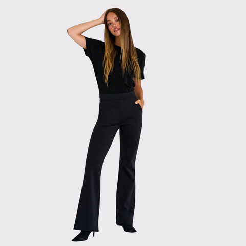 Meet the Flared Pants by Shan bring class and sophistication to any wardrobe. These elegant pants are tailored for a comfortable yet stylish fit, and they feature side pockets. With a classic flared style, these pants can easily be worn from the office to a night out with friends - all while keeping you looking your best! Style these pants with a black top to keep it monochromatic and simple, or add a bit more flare and style it with statement accessories!