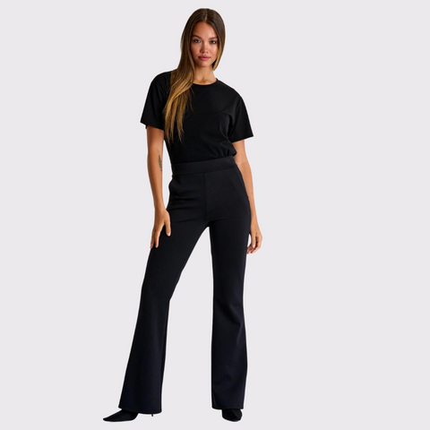 Meet the Flared Pants by Shan bring class and sophistication to any wardrobe. These elegant pants are tailored for a comfortable yet stylish fit, and they feature side pockets. With a classic flared style, these pants can easily be worn from the office to a night out with friends - all while keeping you looking your best! Style these pants with a black top to keep it monochromatic and simple, or add a bit more flare and style it with statement accessories!