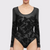 Experience the romance of Wolford's Bodysuit 78312/F23! The high-contrast matte floral lace combines with a slim fit style and seamless design to create an irresistibly beautiful look that's as elegant as it is comfortable. The snap closure and cotton gusset make it easy to wear and the knitted hemlines of the long sleeves add a touch of sophistication. Show off your beauty and grace with this timeless bodysuit!